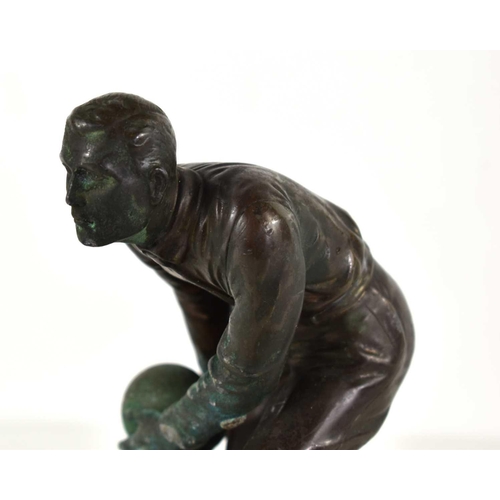 257 - An Art Deco bronze sculpture of a man bowling in the style of Schmidt Hofer, raised on a marble base... 