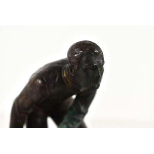 257 - An Art Deco bronze sculpture of a man bowling in the style of Schmidt Hofer, raised on a marble base... 