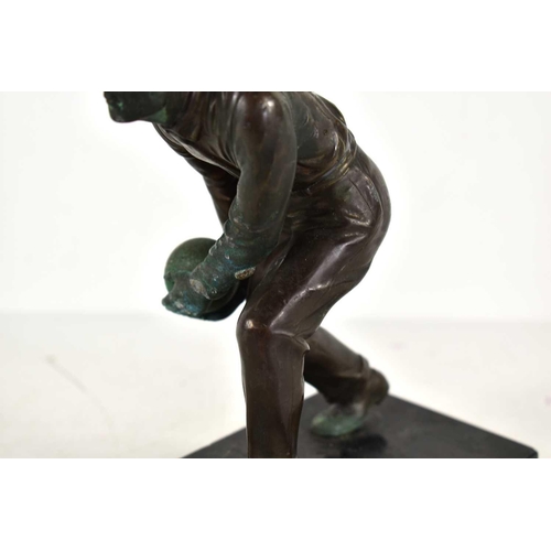 257 - An Art Deco bronze sculpture of a man bowling in the style of Schmidt Hofer, raised on a marble base... 