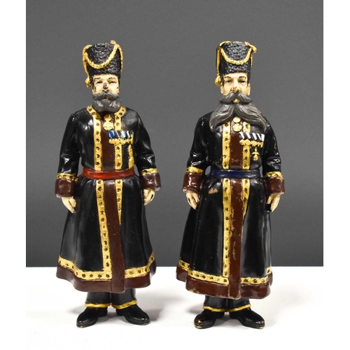 261 - A pair of Russian cold painted bronze soldiers in military uniform, stamped to feet, 19cm high.