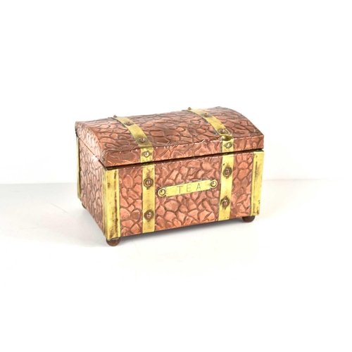 277 - An Arts and Crafts copper and brass bound tea caddy of domed rectangular form with textured finish a... 