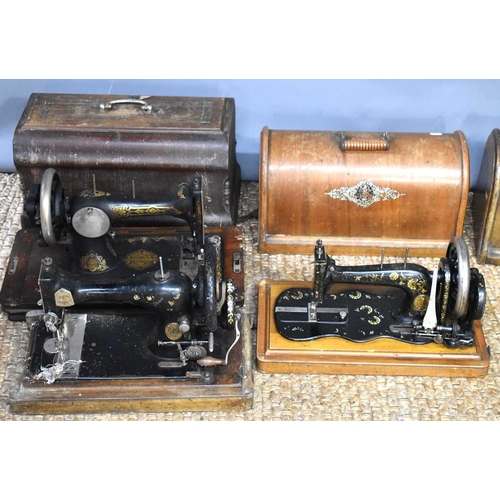 281 - Three antique Singer sewing machines.