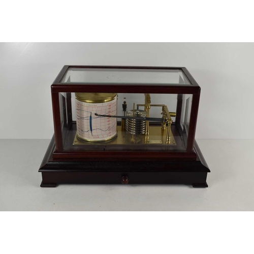 282 - A 20th century mahogany cased barograph by R.W Munro in a bevelled glass case with single draw below... 