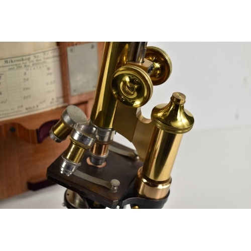 283 - An Ernst Leitz Wetzlar brass microscope, number 76153, with black-painted base in original finish, t... 