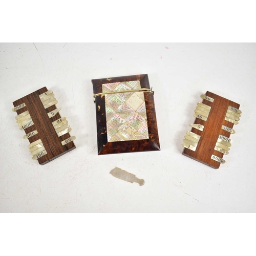 291 - A Victorian mother of pearl and tortoiseshell card case together with two mother of pearl game score... 