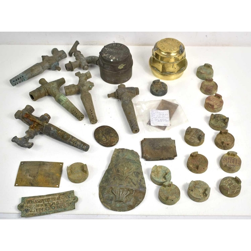 296 - A group of metal detecting finds and collectables to include two brass cart hub caps, Georgian decor... 