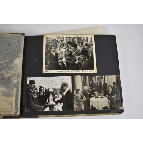 298 - A 1940s photograph album containing photos of King Faroulk presenting the Challenge Cup, Ferusiya Cl... 