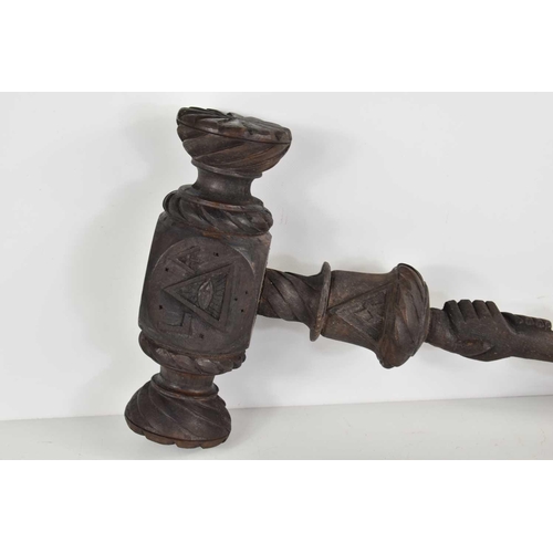 299 - A 19th century Masonic carved wooden ceremonial gavel, carved with various masonic symbols, 36cm, to... 