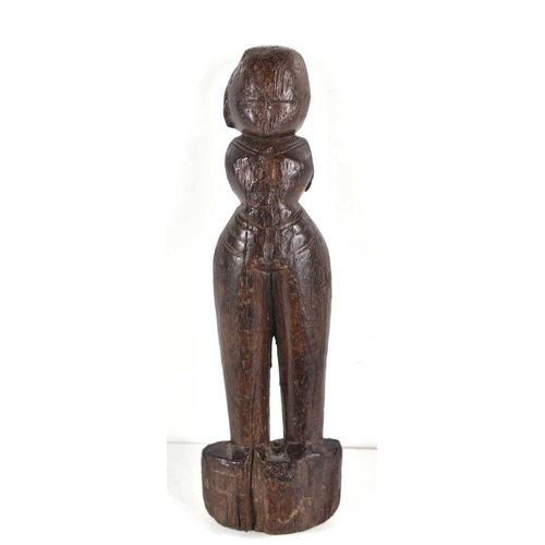 304 - A 19th century African tribal wooden carving of a fertility figure, 23cm.