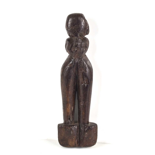 304 - A 19th century African tribal wooden carving of a fertility figure, 23cm.