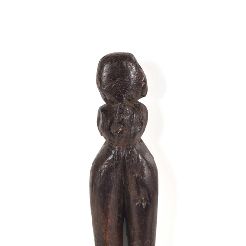 304 - A 19th century African tribal wooden carving of a fertility figure, 23cm.