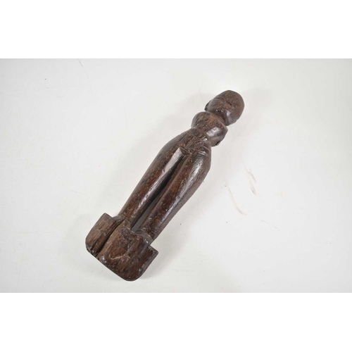 304 - A 19th century African tribal wooden carving of a fertility figure, 23cm.