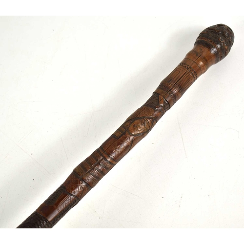 314 - A Japanese bamboo cane carved with warriors, 88cm