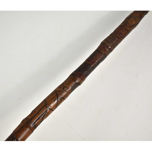 314 - A Japanese bamboo cane carved with warriors, 88cm