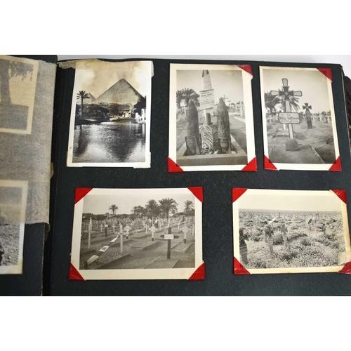 316 - A WWII photograph album containing photos of Jerusalem in 1945, a ship on fire at sea, HMS tracker, ... 