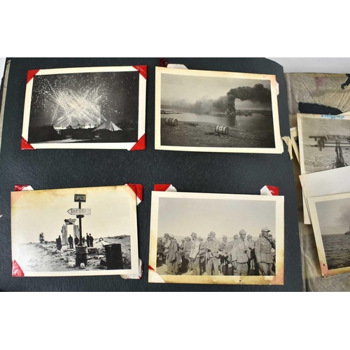 316 - A WWII photograph album containing photos of Jerusalem in 1945, a ship on fire at sea, HMS tracker, ... 