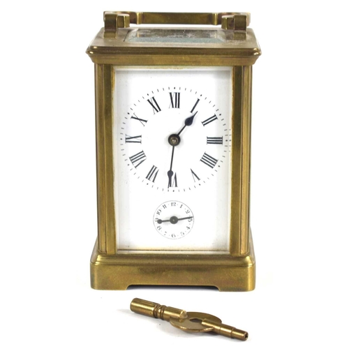 331 - A 19th century brass cased carriage clock with bevelled edge glass, the enamel clock dial with Roman... 