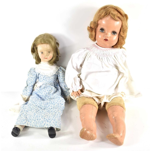 344 - An early 20th century Horsman doll, with soft body and composition limbs together with a smaller dol... 