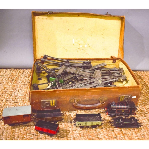 349 - A selection of vintage tin plate railway track and trains, to include locomotive and five carriages ... 