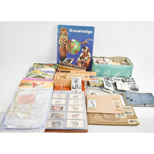 361 - A group of printed ephemera to include sets and albums of cigarette cards, a selection of black and ... 