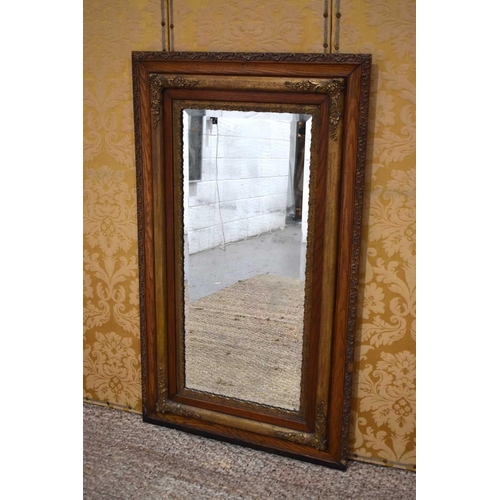 370 - A 19th century oak and gilt hall mirror, the border carved with foliate scrolls, 136.5cm by 80cm.