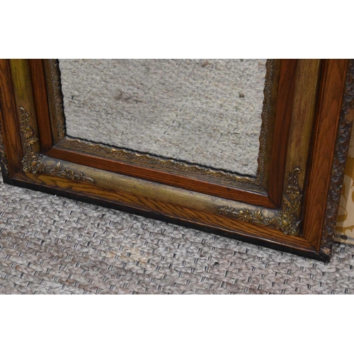 370 - A 19th century oak and gilt hall mirror, the border carved with foliate scrolls, 136.5cm by 80cm.