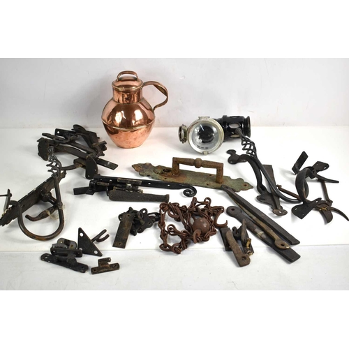 376 - A group of metalware to include a copper jug, lamp, antique hinges, handles and other items.