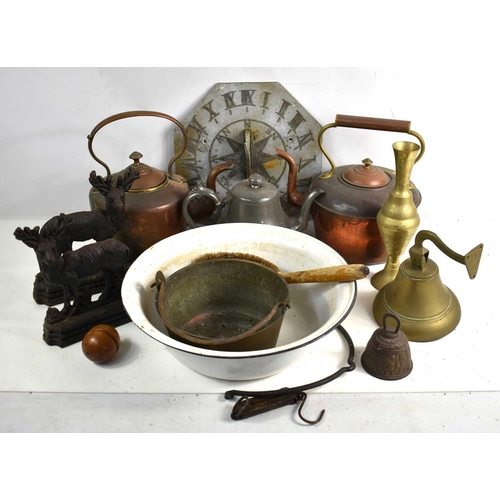 380 - A group of metalware to include copper kettles, brass bell, enamel bowl, cast iron door stop and oth... 