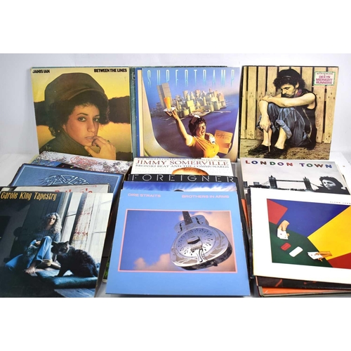 391 - Vinyl records: A group of LPs to include David Bowie 'Lets dance', Elton John, Cat Stevens, Joni Mit... 