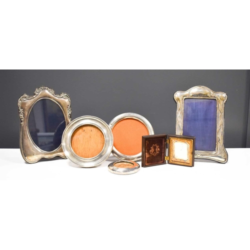 42 - A selection of silver photograph frames, three of circular form, together with a daguerreotype portr... 