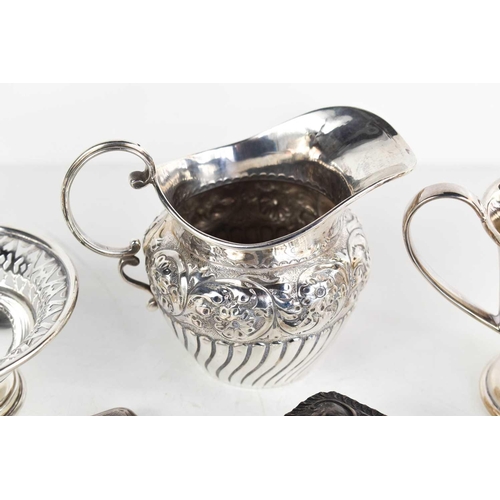 48 - A group of silver to include a small pedestal dish with pierced rim, 1.3toz, a 19th century jug embo... 