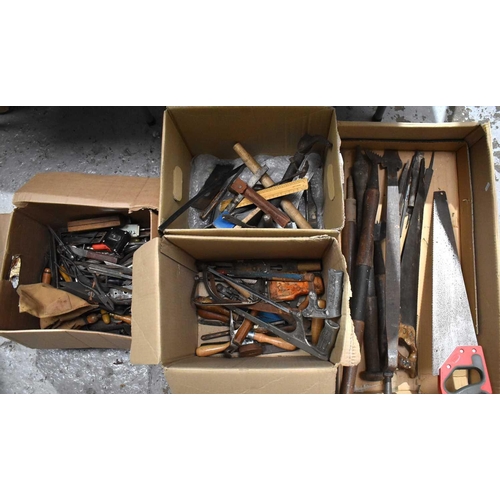 492 - A group of vintage tools to include carpet stretchers, chisels, saws, spanners, pliers, engineering ... 