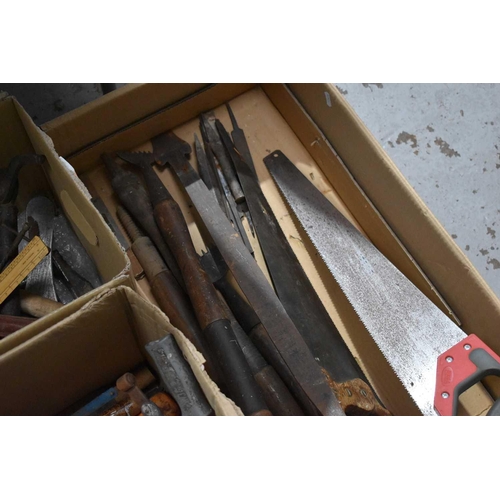 492 - A group of vintage tools to include carpet stretchers, chisels, saws, spanners, pliers, engineering ... 