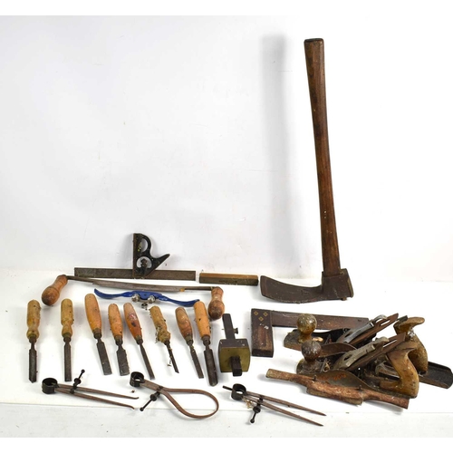 494 - A group of vintage tools to include Sorby draw knife, mattock, Stanley plane, Record spoke shave, ch... 