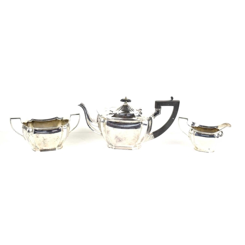 5 - A silver tea set comprising tea pot with ebonised handle, twin handled sugar bowl and cream jug, hal... 