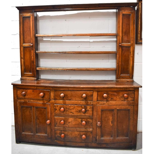 510 - A late 18th / early 19th century dresser & rack, the rack having three shelves flanked by two spice ... 