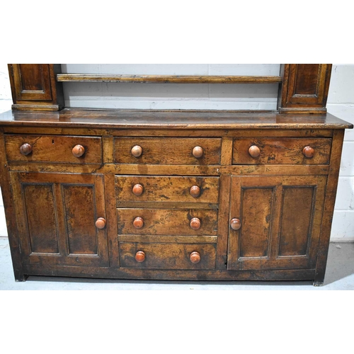 510 - A late 18th / early 19th century dresser & rack, the rack having three shelves flanked by two spice ... 