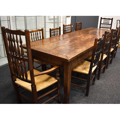 513 - A 19th century antique kitchen / dining table, the planked top with cleated ends and two end drawers... 