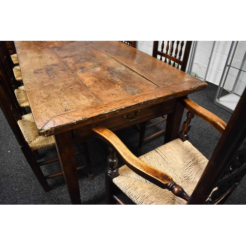 513 - A 19th century antique kitchen / dining table, the planked top with cleated ends and two end drawers... 