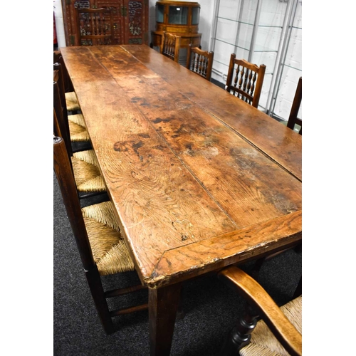 513 - A 19th century antique kitchen / dining table, the planked top with cleated ends and two end drawers... 