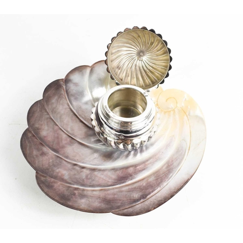 57 - An unusual Victorian silver inkwell and stand, the well set within a fluted sphere, placed on a carv... 