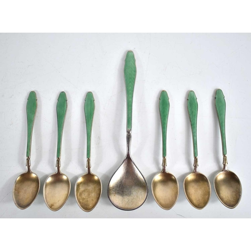 9 - A set of six silver and guilloche enamel coffee spoons together with a matching sauce spoon, 3toz.