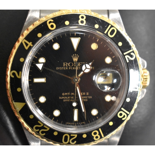 391 - A Rolex GMT Master II Oyster Perpetual gentleman's automatic wristwatch, calibre 3185, black dial wi... 