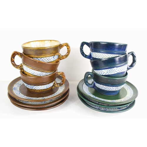 291 - A Henriot Quimper France 333 Pi (20th C.) three-piece teal tea service and three-piece brown tea ser... 