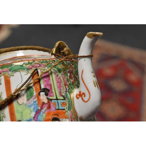 251 - A 19th century Qing Dynasty Famille Rose Chinese tea pot, the vistas depicting interior figural scen... 