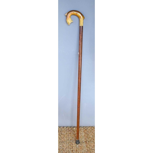 257 - A vintage horn and wooden walking cane, the horn handle carved in the form of a fish, and painted wi... 