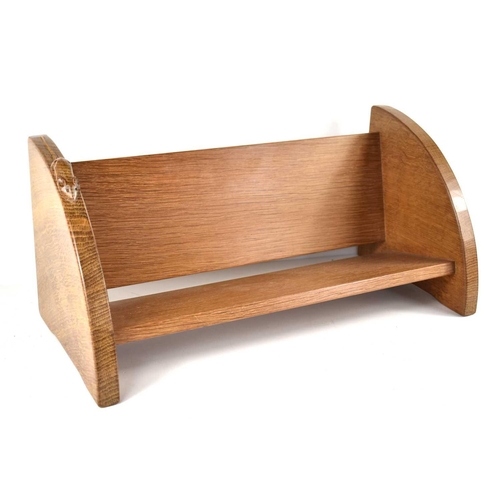 261 - A Robert 'Mouseman' Thompson oak book trough, with carved mouse trademark, 45.5cm.