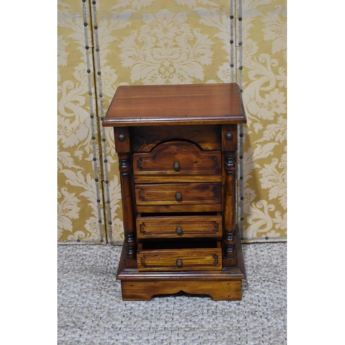 355 - CHARITY LOT: A small hardwood bedside cabinet with four drawers.