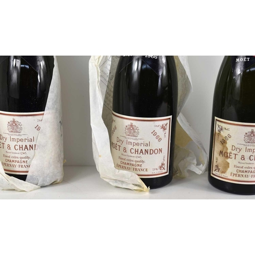 42 - Three bottles of Moet & Chandon Dry Imperial 1966 vintage champagne