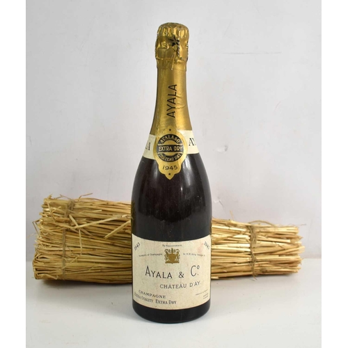 67 - A bottle of Ayala & Co, Chateau d'Ay champagne, 1945 label, with straw packing.